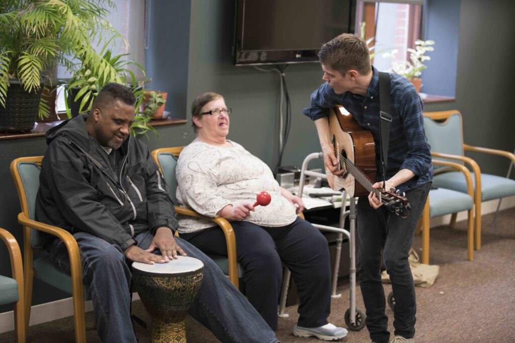 Three people playing music.